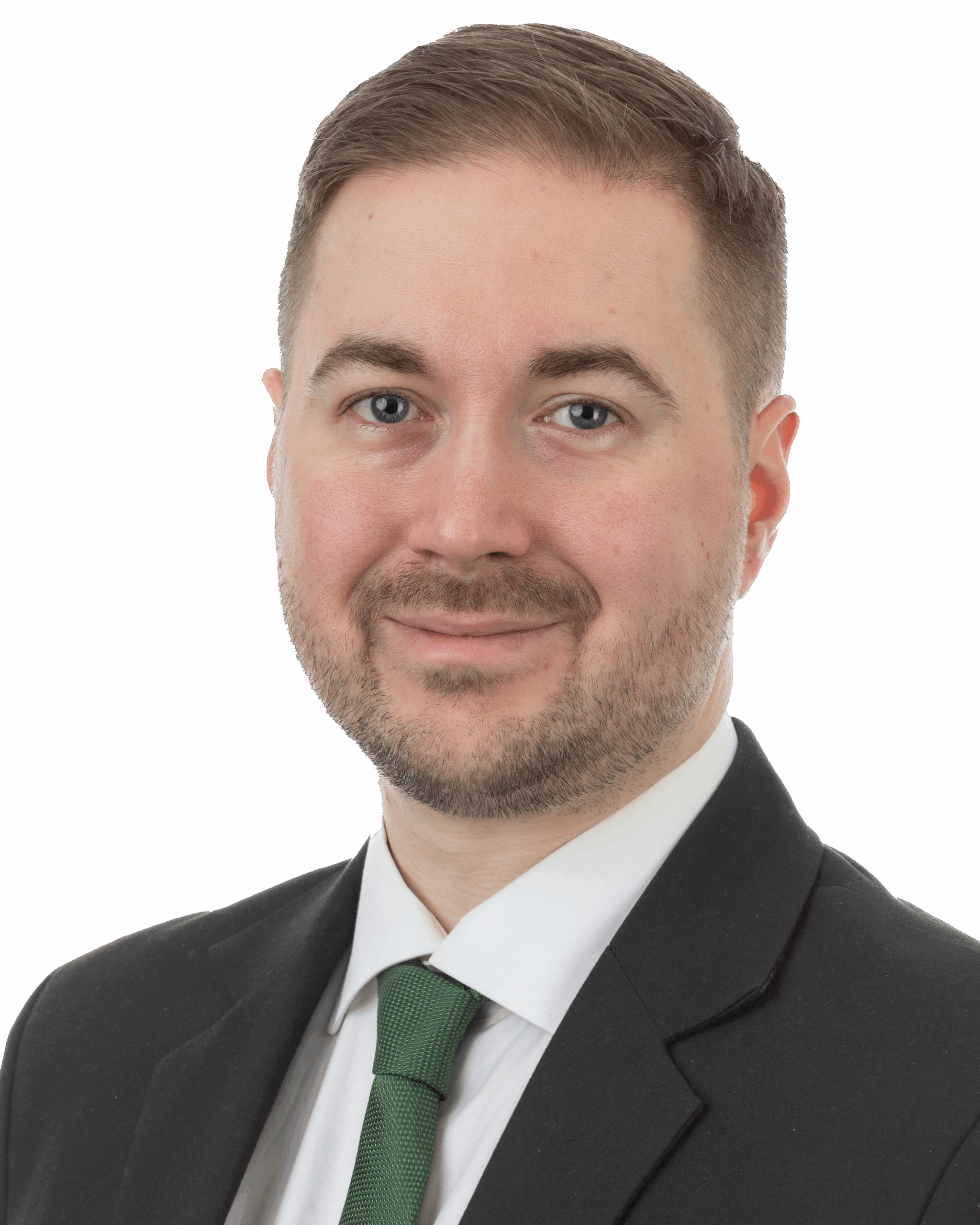 Lauri Lavanti Kuva Lauri Lavannista hymyilemässä, päällään puku ja vihreä kravatti